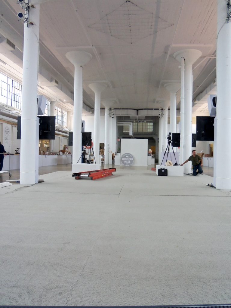 carpet being rolled out before the chairs were placed. No detail was spared. These people are something else! This image was taken with the stage to my back. Literally leaning on it. Beyond that small white wall in the far back was the display for the honorees and the entrance to the clerestory, to your left and to your right were the vendor tables...fyi)